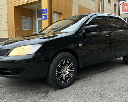 Чорний Міцубісі Lancer, об'ємом двигуна 1.58 л та пробігом 167 тис. км за 4800 $, фото 1 на Automoto.ua