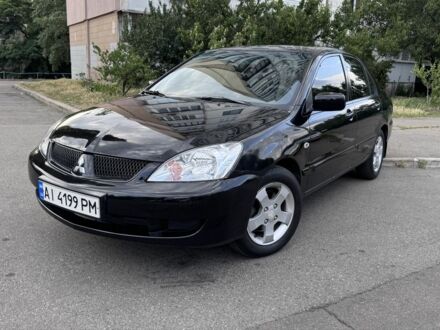 Міцубісі Lancer 2008 у Києві на Automoto.ua Чорний Міцубісі Lancer, об'ємом двигуна 1.6 л та пробігом 264 тис. км за 3699 $, фото 1 на Automoto.ua