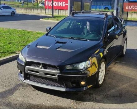 Чорний Міцубісі Lancer, об'ємом двигуна 2 л та пробігом 134 тис. км за 29034 $, фото 1 на Automoto.ua