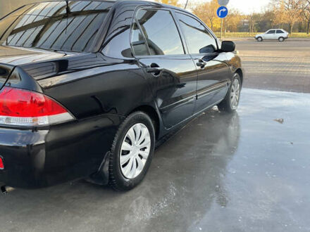 Черный Мицубиси Лансер, объемом двигателя 1.59 л и пробегом 348 тыс. км за 4200 $, фото 1 на Automoto.ua