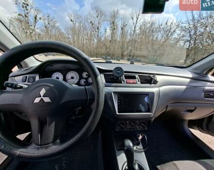 Черный Мицубиси Лансер, объемом двигателя 1.58 л и пробегом 128 тыс. км за 5300 $, фото 1 на Automoto.ua