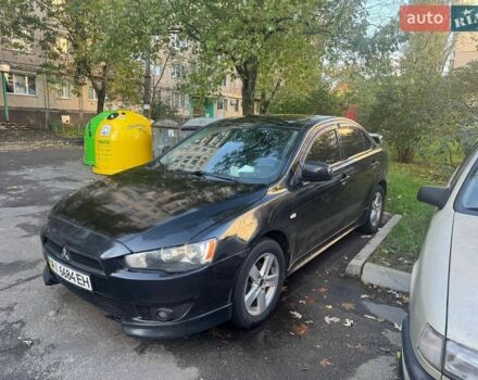 Черный Мицубиси Лансер, объемом двигателя 2 л и пробегом 301 тыс. км за 7300 $, фото 1 на Automoto.ua