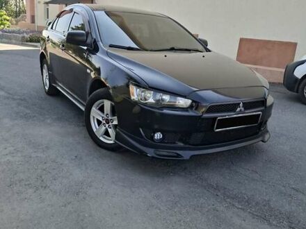 Черный Мицубиси Лансер, объемом двигателя 2 л и пробегом 230 тыс. км за 7000 $, фото 1 на Automoto.ua