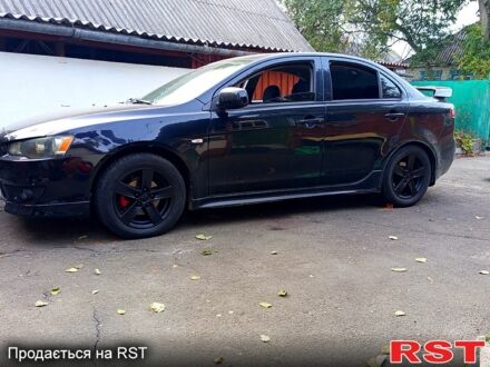 Черный Мицубиси Лансер, объемом двигателя 2 л и пробегом 260 тыс. км за 7000 $, фото 1 на Automoto.ua