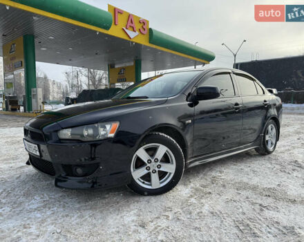 Черный Мицубиси Лансер, объемом двигателя 2 л и пробегом 195 тыс. км за 6800 $, фото 1 на Automoto.ua