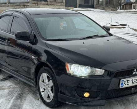 Черный Мицубиси Лансер, объемом двигателя 2 л и пробегом 280 тыс. км за 6800 $, фото 1 на Automoto.ua
