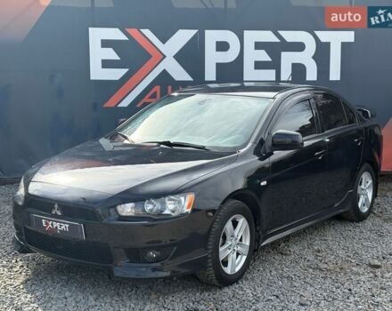 Черный Мицубиси Лансер, объемом двигателя 2 л и пробегом 245 тыс. км за 5990 $, фото 1 на Automoto.ua