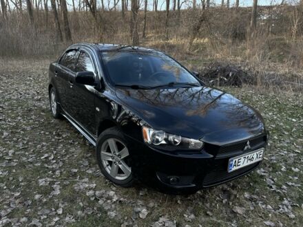 Черный Мицубиси Лансер, объемом двигателя 2 л и пробегом 224 тыс. км за 6500 $, фото 1 на Automoto.ua