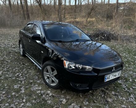 Черный Мицубиси Лансер, объемом двигателя 2 л и пробегом 224 тыс. км за 6500 $, фото 1 на Automoto.ua