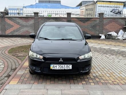 Чорний Міцубісі Lancer, об'ємом двигуна 2 л та пробігом 186 тис. км за 6600 $, фото 1 на Automoto.ua