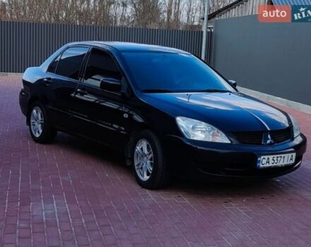 Черный Мицубиси Лансер, объемом двигателя 1.6 л и пробегом 409 тыс. км за 3300 $, фото 1 на Automoto.ua