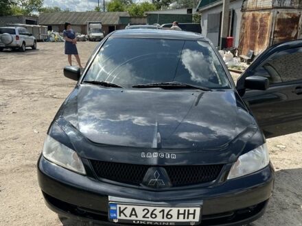 Черный Мицубиси Лансер, объемом двигателя 1.6 л и пробегом 211 тыс. км за 3100 $, фото 1 на Automoto.ua