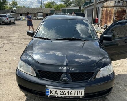 Черный Мицубиси Лансер, объемом двигателя 1.6 л и пробегом 211 тыс. км за 3100 $, фото 1 на Automoto.ua