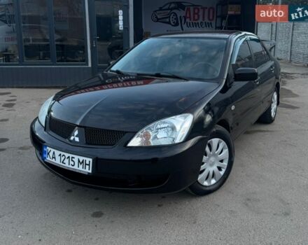 Черный Мицубиси Лансер, объемом двигателя 1.58 л и пробегом 305 тыс. км за 5800 $, фото 1 на Automoto.ua