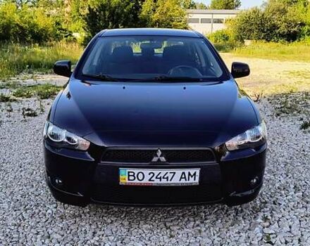 Черный Мицубиси Лансер, объемом двигателя 2 л и пробегом 204 тыс. км за 6700 $, фото 1 на Automoto.ua