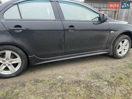 Черный Мицубиси Лансер, объемом двигателя 2 л и пробегом 260 тыс. км за 6000 $, фото 1 на Automoto.ua