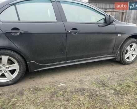 Черный Мицубиси Лансер, объемом двигателя 2 л и пробегом 260 тыс. км за 6000 $, фото 1 на Automoto.ua