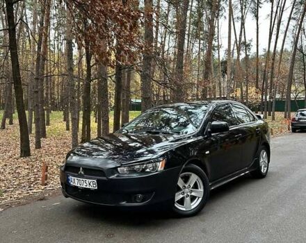 Черный Мицубиси Лансер, объемом двигателя 2 л и пробегом 216 тыс. км за 5600 $, фото 1 на Automoto.ua