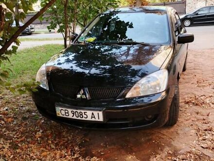 Чорний Міцубісі Lancer, об'ємом двигуна 1.58 л та пробігом 204 тис. км за 4200 $, фото 1 на Automoto.ua