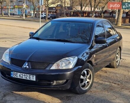 Черный Мицубиси Лансер, объемом двигателя 1.58 л и пробегом 220 тыс. км за 4400 $, фото 1 на Automoto.ua
