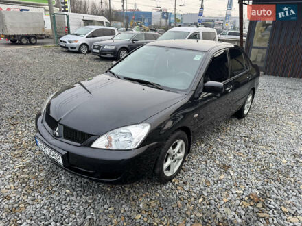 Чорний Міцубісі Lancer, об'ємом двигуна 1.58 л та пробігом 202 тис. км за 4100 $, фото 1 на Automoto.ua