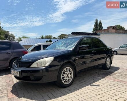 Черный Мицубиси Лансер, объемом двигателя 1.58 л и пробегом 250 тыс. км за 3999 $, фото 1 на Automoto.ua