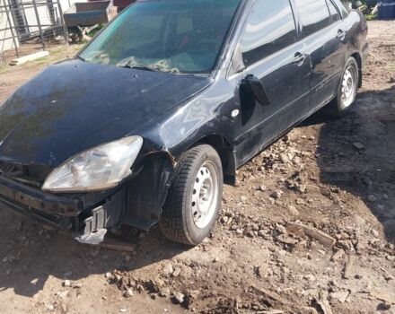 Чорний Міцубісі Lancer, об'ємом двигуна 2 л та пробігом 100 тис. км за 2000 $, фото 1 на Automoto.ua