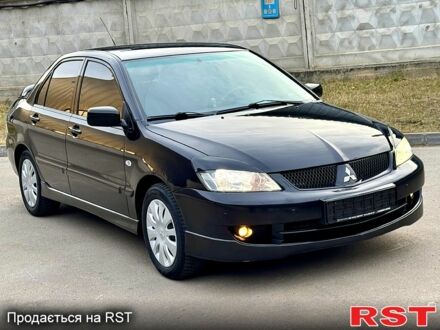 Міцубісі Lancer 2008 у Києві на Automoto.ua Чорний Міцубісі Lancer, об'ємом двигуна 16 л та пробігом 230 тис. км за 4600 $, фото 1 на Automoto.ua