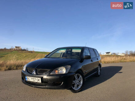 Черный Мицубиси Лансер, объемом двигателя 1.58 л и пробегом 206 тыс. км за 2900 $, фото 1 на Automoto.ua