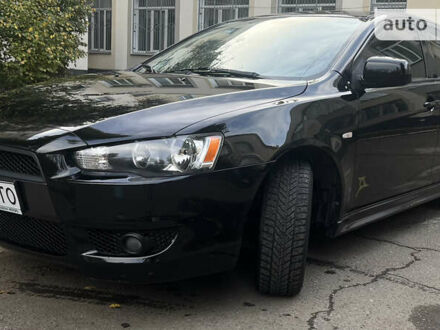 Чорний Міцубісі Lancer, об'ємом двигуна 2 л та пробігом 206 тис. км за 5600 $, фото 1 на Automoto.ua