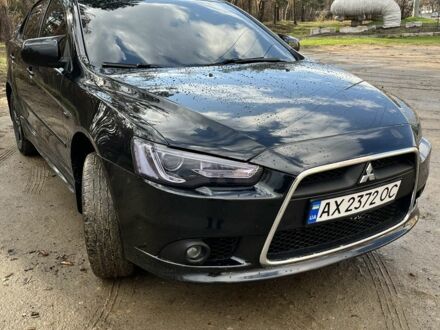 Чорний Міцубісі Lancer, об'ємом двигуна 2 л та пробігом 240 тис. км за 7299 $, фото 1 на Automoto.ua
