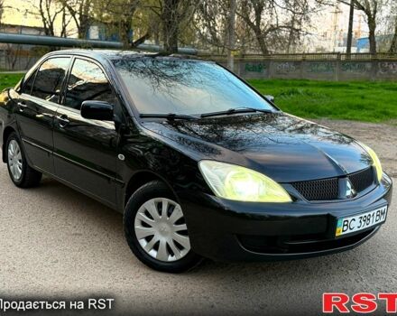 Черный Мицубиси Лансер, объемом двигателя 1.6 л и пробегом 220 тыс. км за 5300 $, фото 1 на Automoto.ua