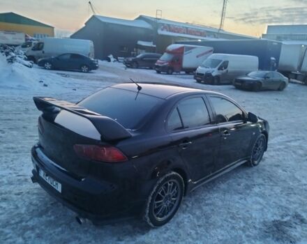 Черный Мицубиси Лансер, объемом двигателя 2 л и пробегом 243 тыс. км за 6950 $, фото 1 на Automoto.ua