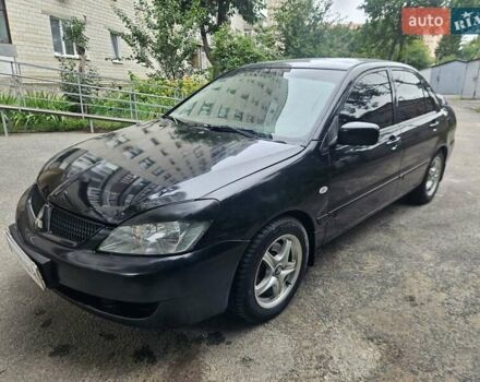 Чорний Міцубісі Lancer, об'ємом двигуна 1.6 л та пробігом 218 тис. км за 3600 $, фото 1 на Automoto.ua