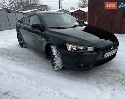 Черный Мицубиси Лансер, объемом двигателя 2 л и пробегом 163 тыс. км за 7500 $, фото 1 на Automoto.ua