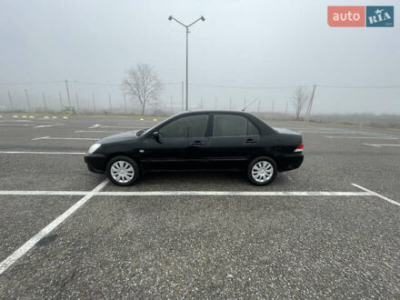 Черный Мицубиси Лансер, объемом двигателя 1.58 л и пробегом 214 тыс. км за 4400 $, фото 1 на Automoto.ua