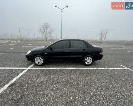 Черный Мицубиси Лансер, объемом двигателя 1.58 л и пробегом 214 тыс. км за 4400 $, фото 1 на Automoto.ua