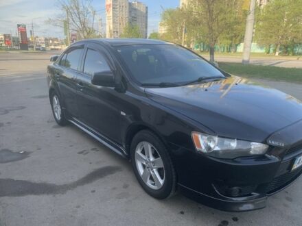 Чорний Міцубісі Lancer, об'ємом двигуна 2 л та пробігом 170 тис. км за 7249 $, фото 1 на Automoto.ua