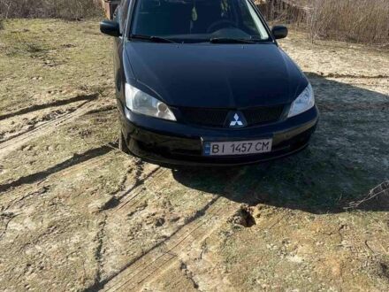 Чорний Міцубісі Lancer, об'ємом двигуна 0.16 л та пробігом 246 тис. км за 4000 $, фото 1 на Automoto.ua