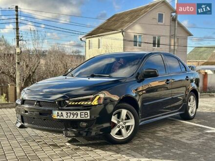 Чорний Міцубісі Lancer, об'ємом двигуна 2 л та пробігом 150 тис. км за 7999 $, фото 1 на Automoto.ua