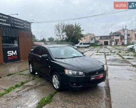 Черный Мицубиси Лансер, объемом двигателя 2 л и пробегом 161 тыс. км за 5700 $, фото 1 на Automoto.ua