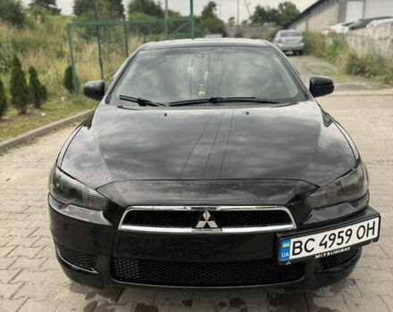 Черный Мицубиси Лансер, объемом двигателя 1.5 л и пробегом 230 тыс. км за 6000 $, фото 1 на Automoto.ua