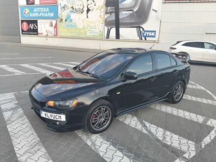 Черный Мицубиси Лансер, объемом двигателя 2 л и пробегом 248 тыс. км за 6500 $, фото 1 на Automoto.ua