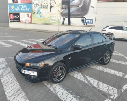 Черный Мицубиси Лансер, объемом двигателя 2 л и пробегом 248 тыс. км за 6500 $, фото 1 на Automoto.ua