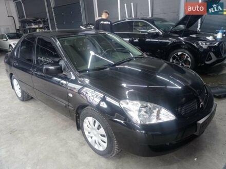 Чорний Міцубісі Lancer, об'ємом двигуна 1.58 л та пробігом 80 тис. км за 5900 $, фото 1 на Automoto.ua