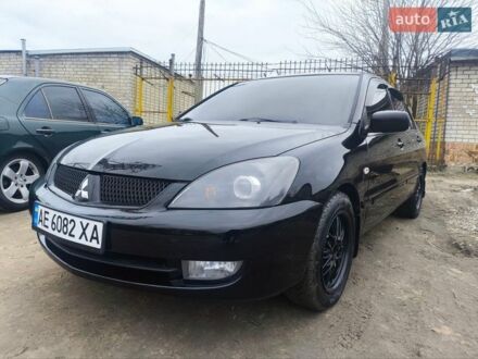 Черный Мицубиси Лансер, объемом двигателя 1.58 л и пробегом 243 тыс. км за 5600 $, фото 1 на Automoto.ua