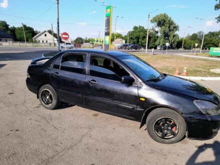 Чорний Міцубісі Lancer, об'ємом двигуна 1.6 л та пробігом 1000 тис. км за 1687 $, фото 1 на Automoto.ua
