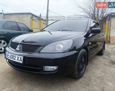 Черный Мицубиси Лансер, объемом двигателя 1.58 л и пробегом 243 тыс. км за 5600 $, фото 1 на Automoto.ua