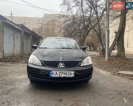 Черный Мицубиси Лансер, объемом двигателя 1.6 л и пробегом 143 тыс. км за 3000 $, фото 1 на Automoto.ua