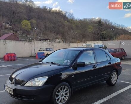 Черный Мицубиси Лансер, объемом двигателя 1.6 л и пробегом 274 тыс. км за 3800 $, фото 1 на Automoto.ua